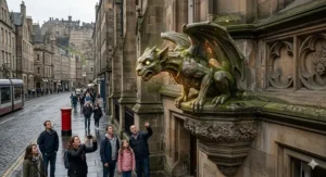 A stone gargoyle on an Edinburgh building coming to life as tourists watch from the cobbled street below.