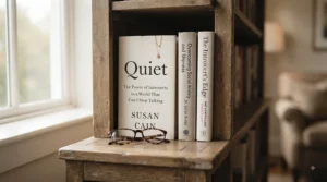 A peaceful corner of a home library featuring books dedicated to overcoming social anxiety and boosting inner confidence.